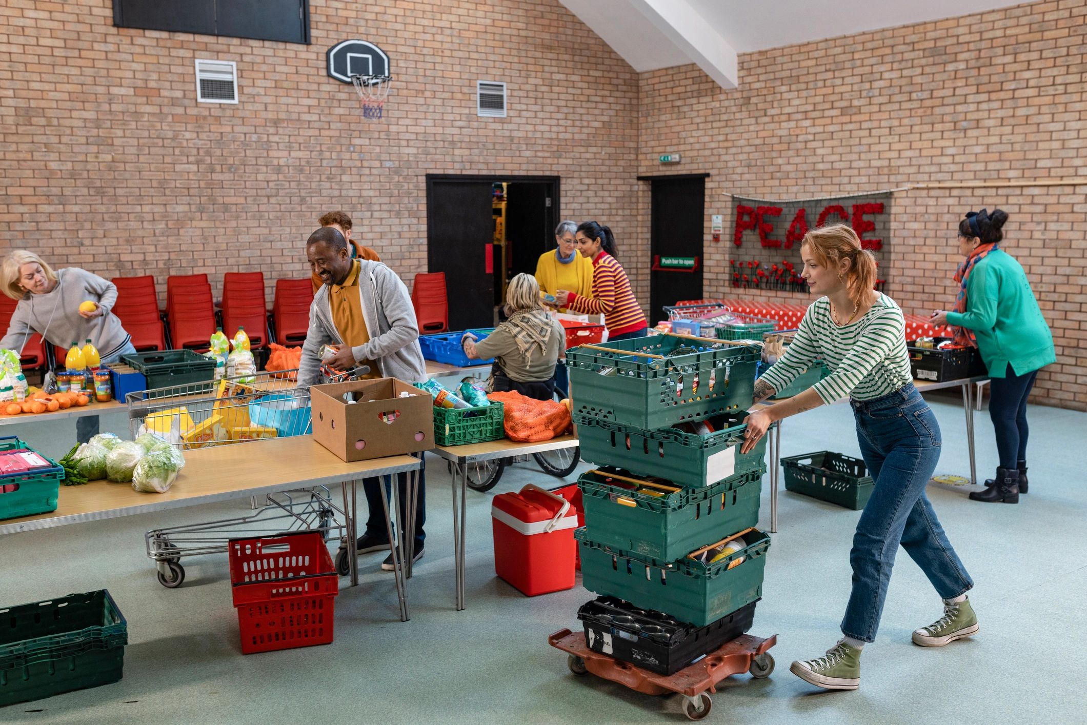 Volunteers organizing food donations in a community outreach setting