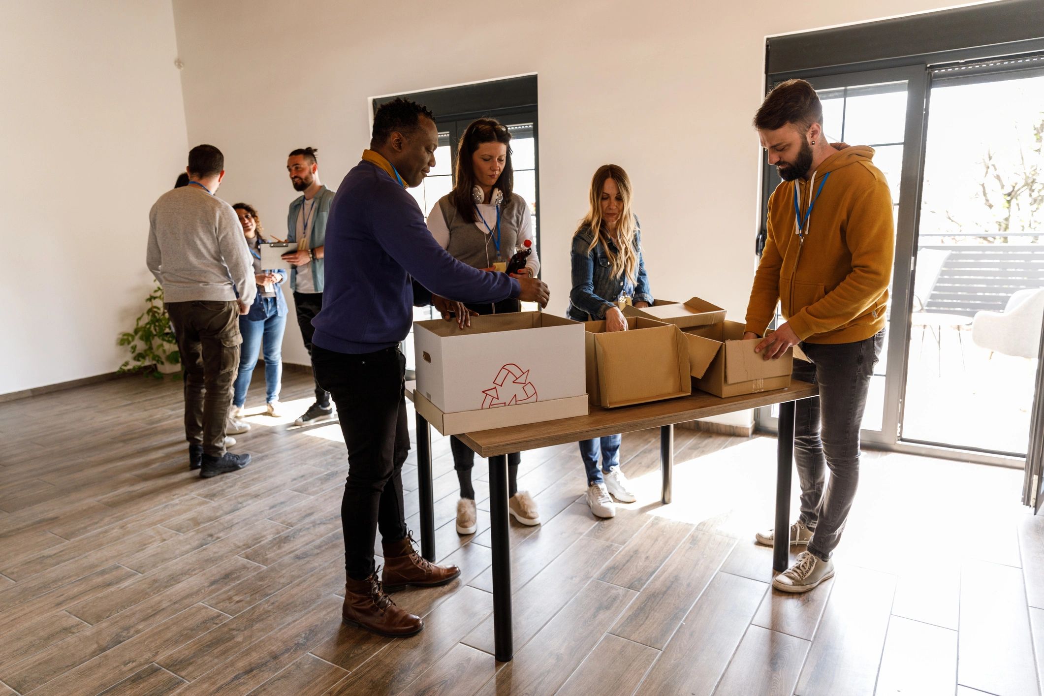 Volunteers working together with donation boxes at a community outreach center